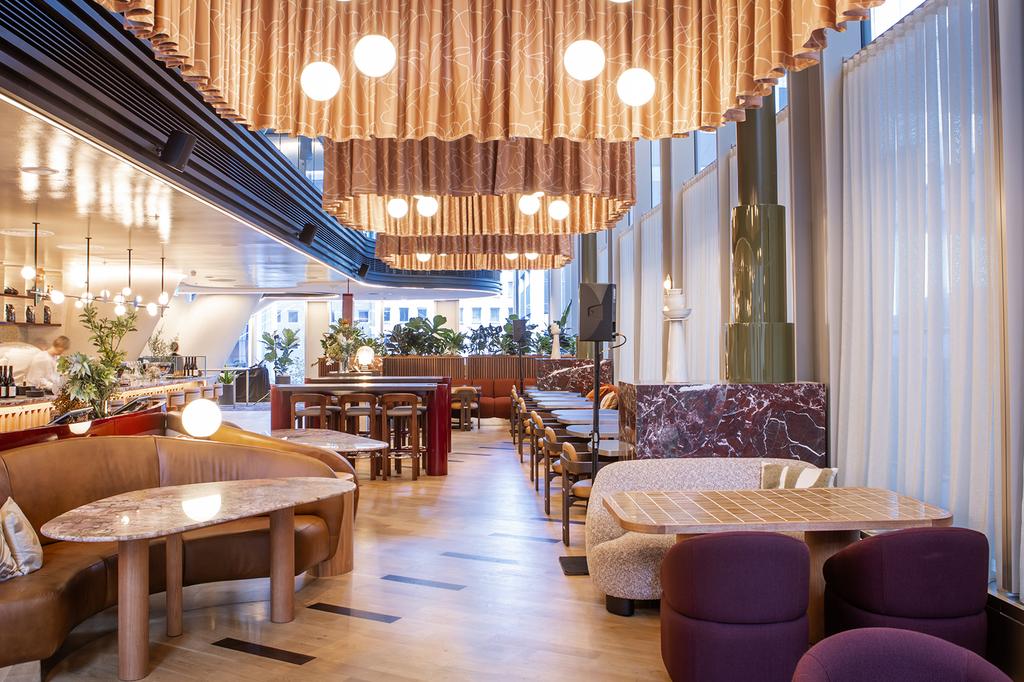 Chic hotel lounge with modern decor and ambient lighting at Citadines Walker North Sydney.