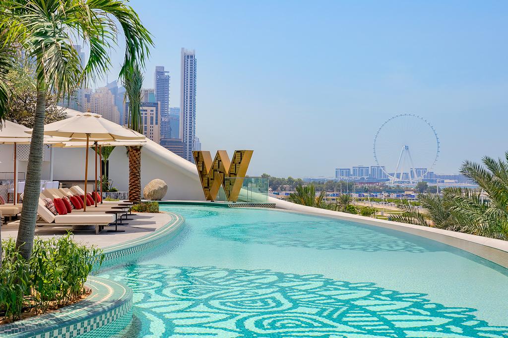 Luxurious poolside view at Dubai's iconic Jumeirah Beach resort.