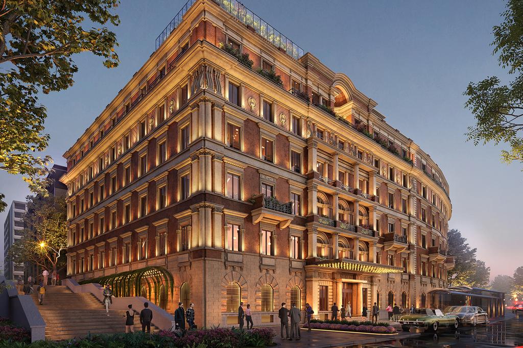 Five-star hotel in Rome with elegant, illuminated facade and classic architecture.
