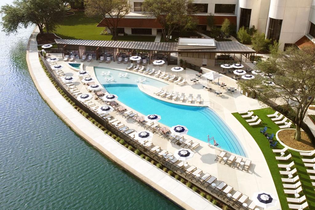 Resort-style pool at a Dallas retreat overlooking Lake Carolyn.