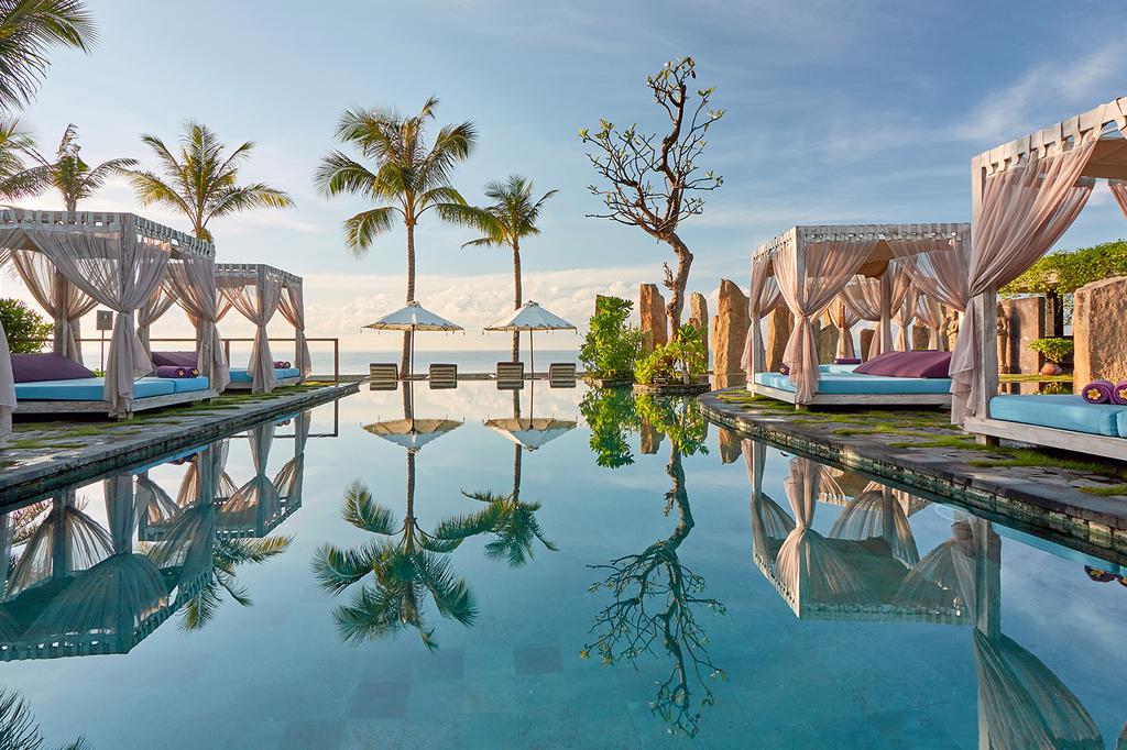 Infinity pool with cabanas at Bali's Royal Purnama resort.