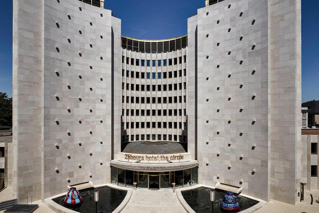 Circular hotel in Cologne with modern architecture and artistic design.