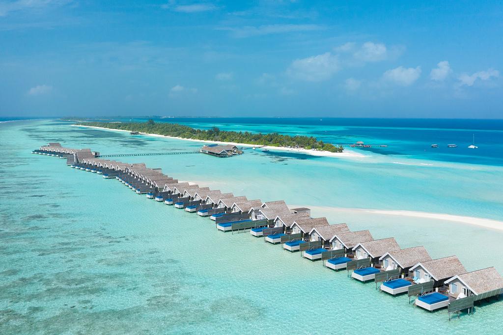 Overwater villas with private pools at a luxurious Maldives resort.