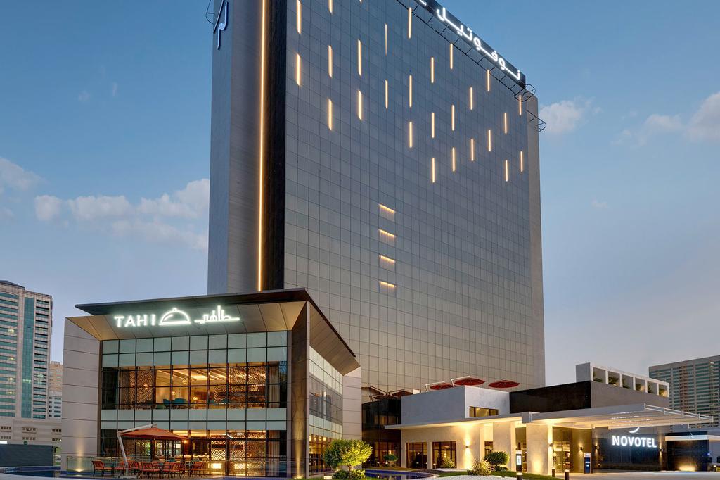 Exterior view of Novotel Sharjah near Expo Centre with Tahi restaurant.