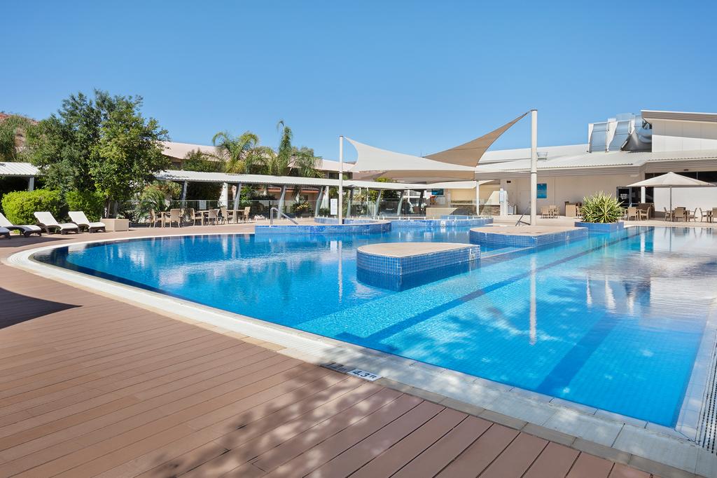 Elegant pool area at Crowne Plaza Alice Springs Lasseters hotel.