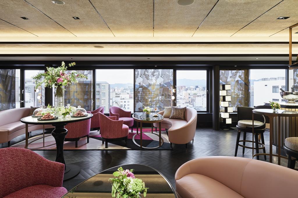 Chic rooftop bar with panoramic views in a Kyoto boutique hotel. 