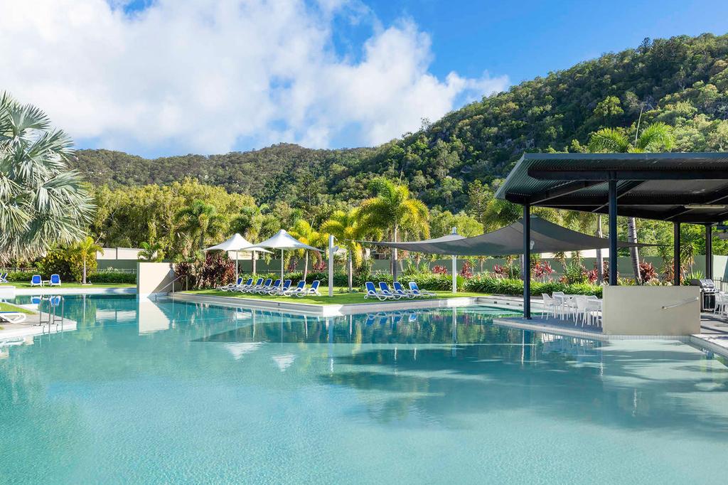 Resort pool area surrounded by lush greenery on Magnetic Island.