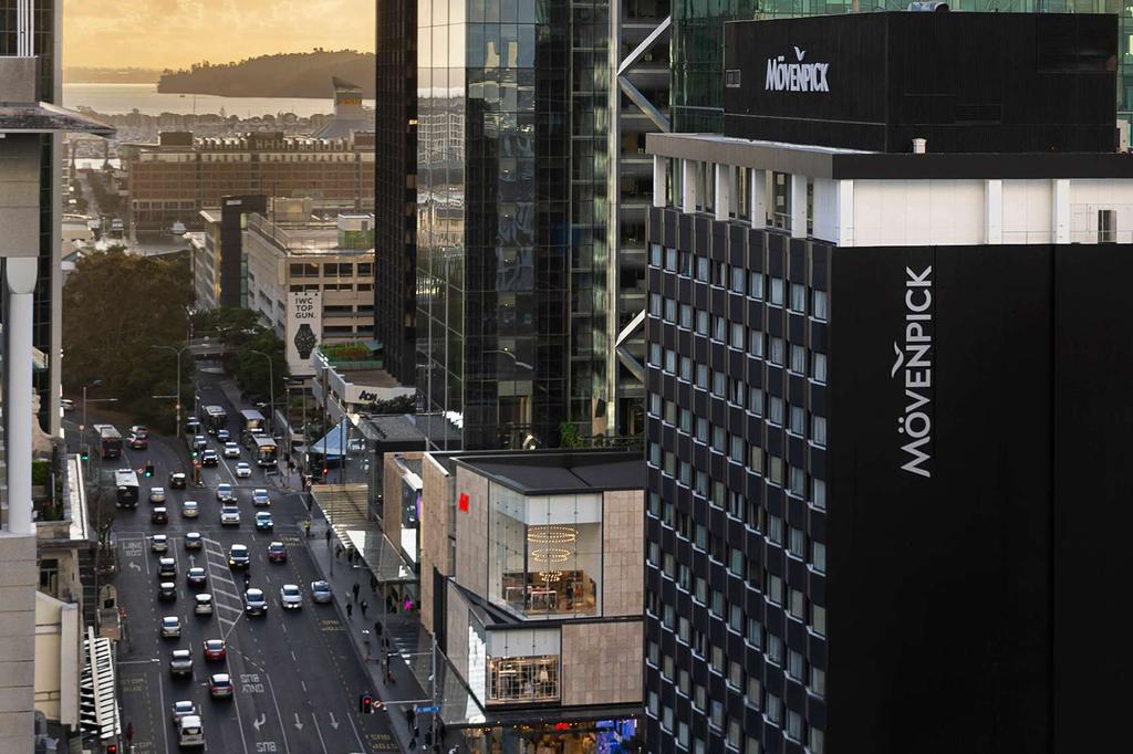 Mövenpick Hotel Auckland towering in the city skyline near Viaduct Harbour.