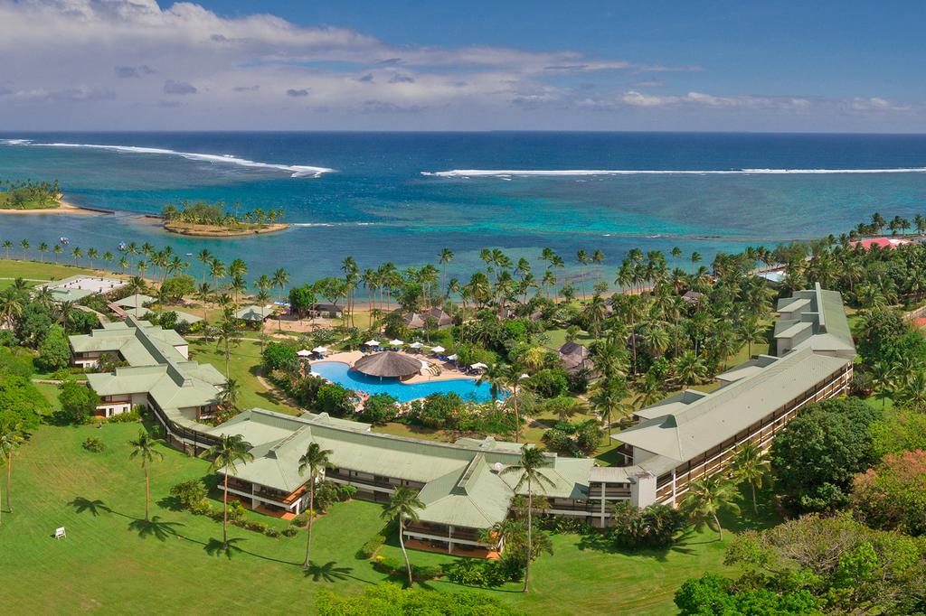 Aerial view of beachfront resort on Fiji’s Coral Coast with pool and ocean.