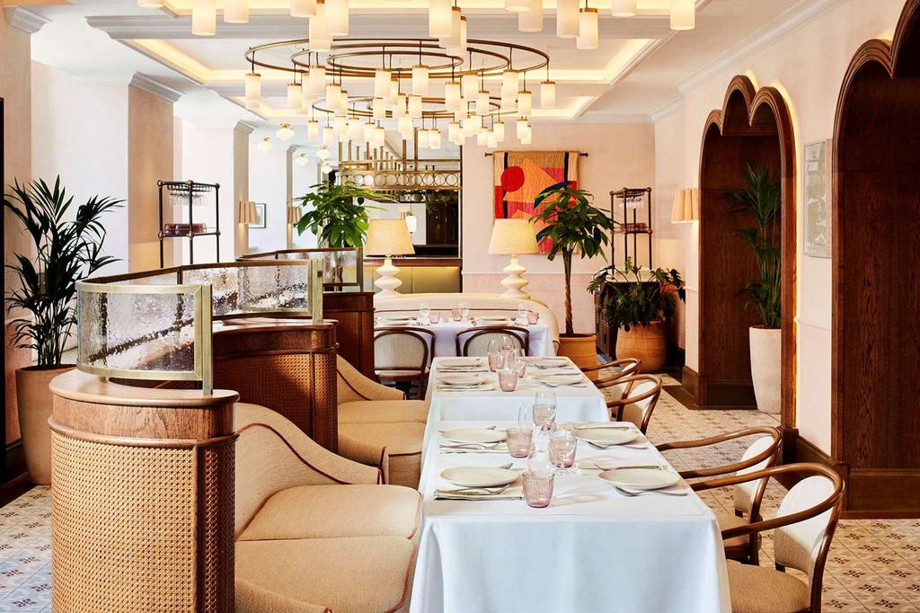 Elegant restaurant interior with tables set for dining at Hyde London City.