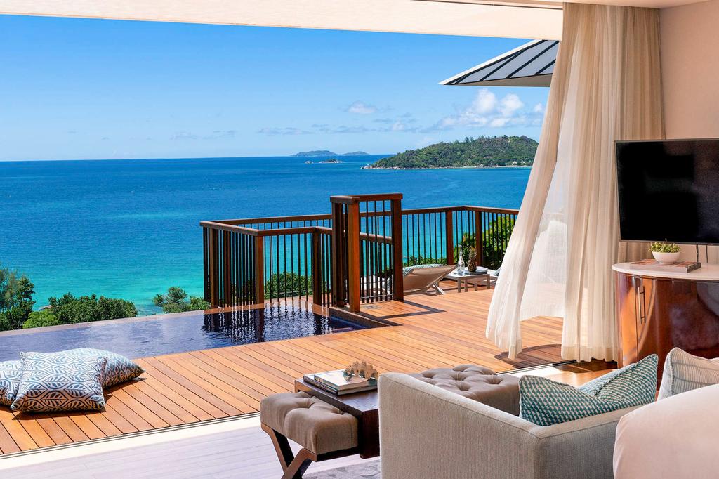 Luxurious villa with private infinity pool overlooking pristine Seychelles ocean.