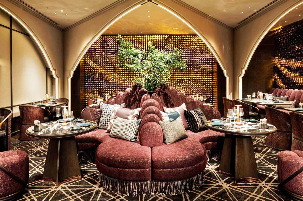 Elegant restaurant with plush seating and modern decor.