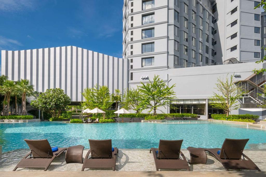 Outdoor garden pool at a stylish hotel in coastal Rayong, Thailand.