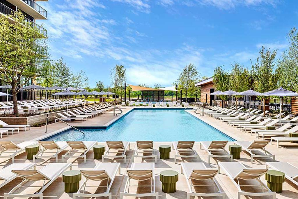 Luxurious poolside seating at a contemporary Frisco golf resort.
