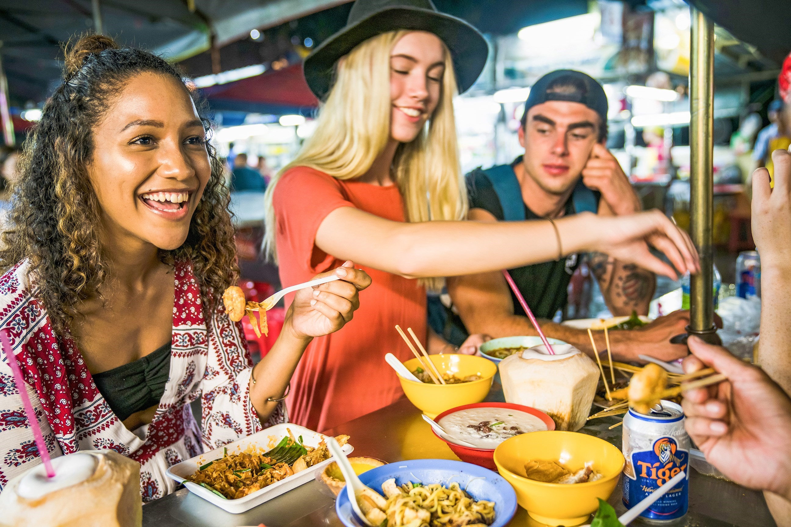 Travellers sharing a meal in Asia