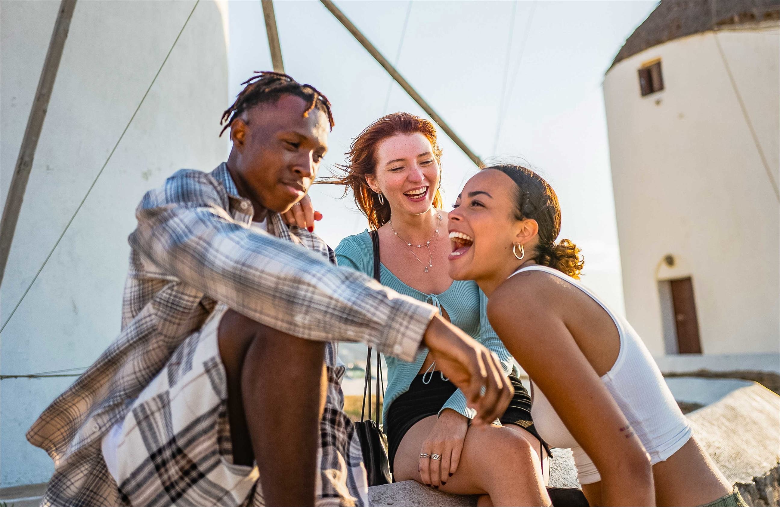 Three travelers laughing and enjoying their time