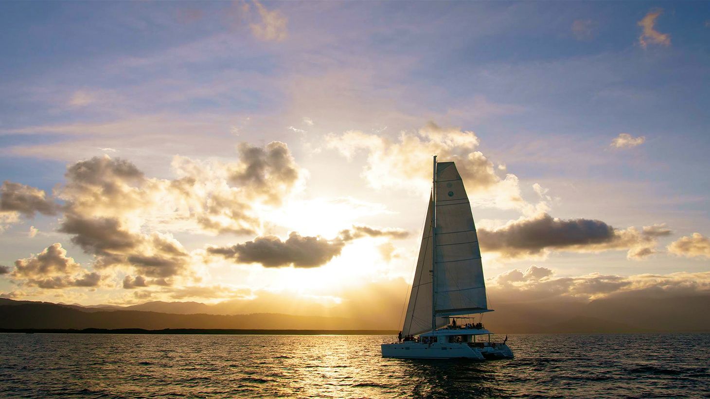 1.5-Hour Sunset Sailing Tour Over the Coral Sea with Canapes & Welcome Drink 1