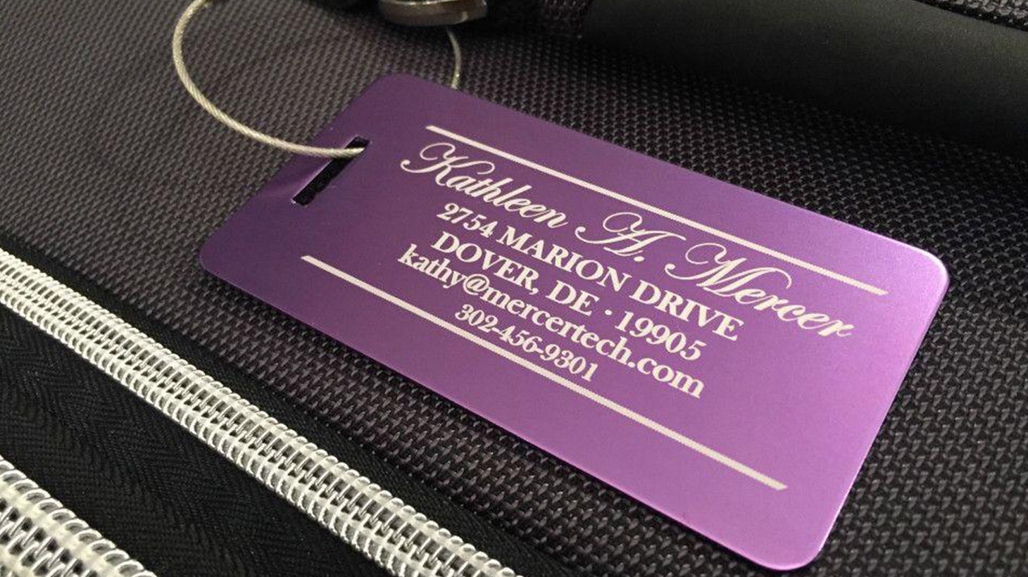 purple luggage tags