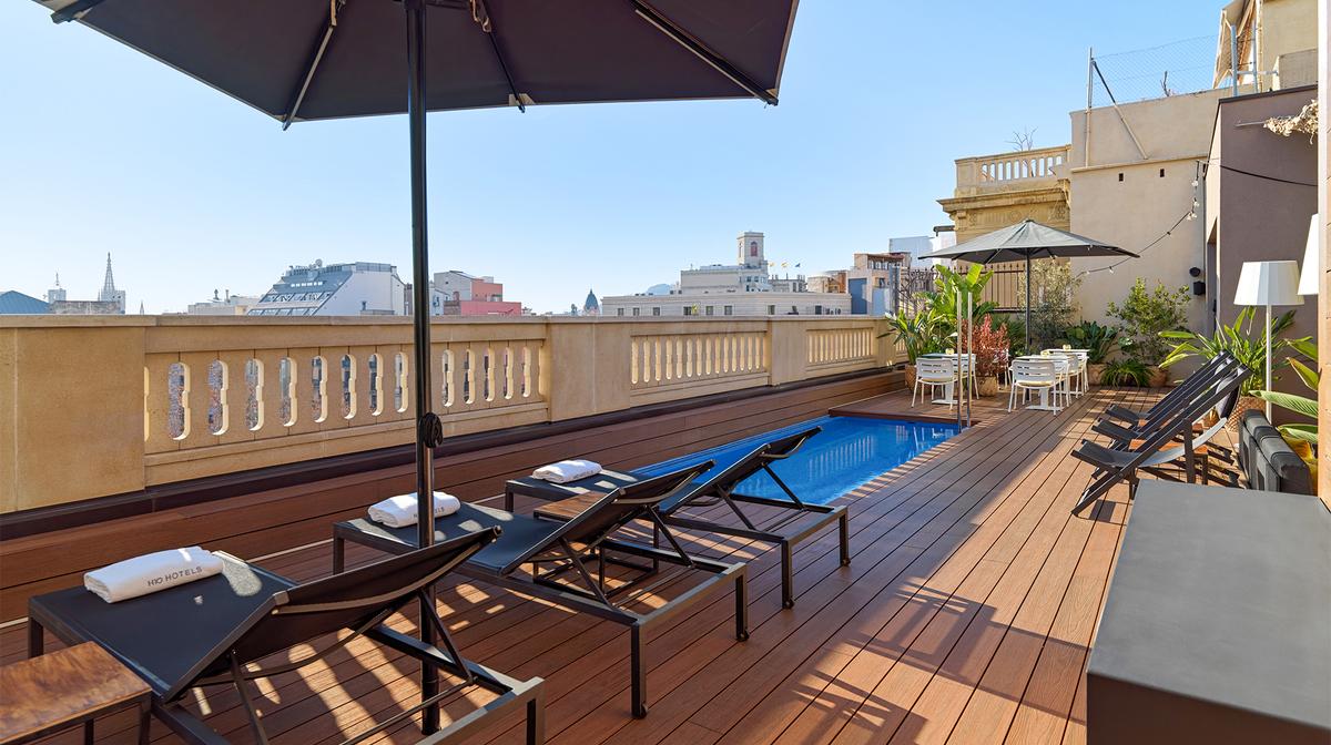 Heritage Barcelona Retreat Steps from Passeig de Gracia with Rooftop Pool & Daily Breakfast