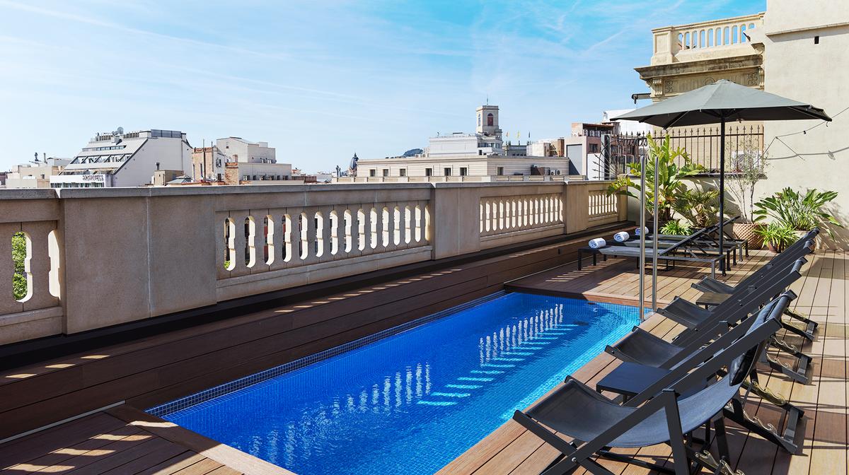 Heritage Barcelona Retreat Steps from Passeig de Gracia with Rooftop Pool & Daily Breakfast