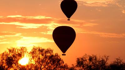 Early Morning 30-Minute Outback Hot Air Balloon Experience with Glass of Sparkling Wine & Return Transfers
