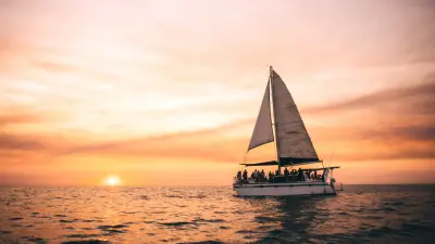 Idyllic Three-Hour Sunset Cruise on Catamaran with Canapes, Floating Cocktail Bar & Return Transfers