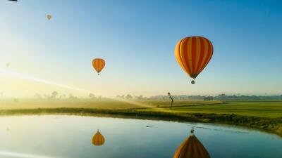 Early Morning Gold Coast Hot Air Ballooning Adventure with Glass of Sparkling Wine & Return Transfers