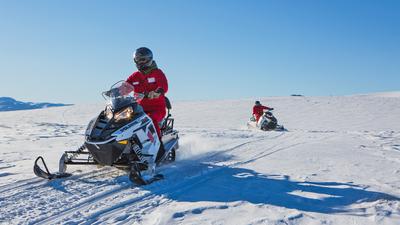 2.5-Hour Wilderness Snowmobiling Adventure with Scenic Return Helicopter Flight