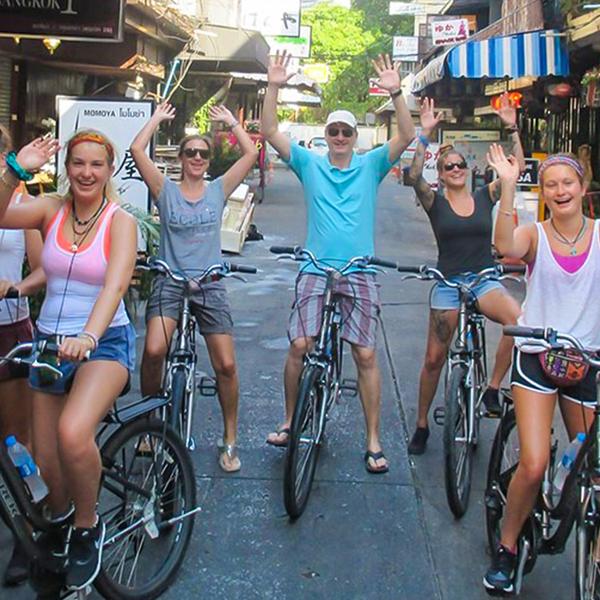 Explore the Bustling City & Backstreets on an Afternoon Biking Tour with Snacks & Drinks 2