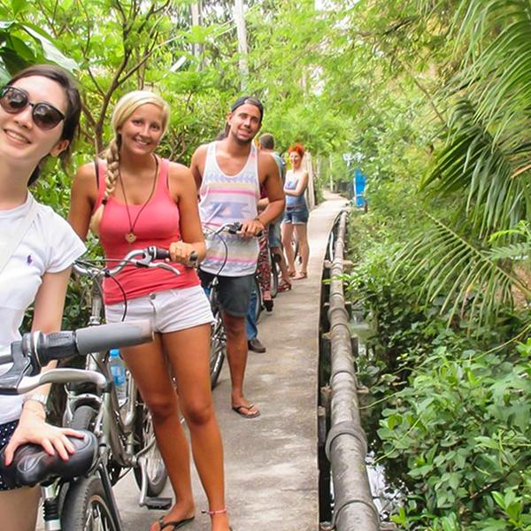 Explore the Bustling City & Backstreets on an Afternoon Biking Tour with Snacks & Drinks 1