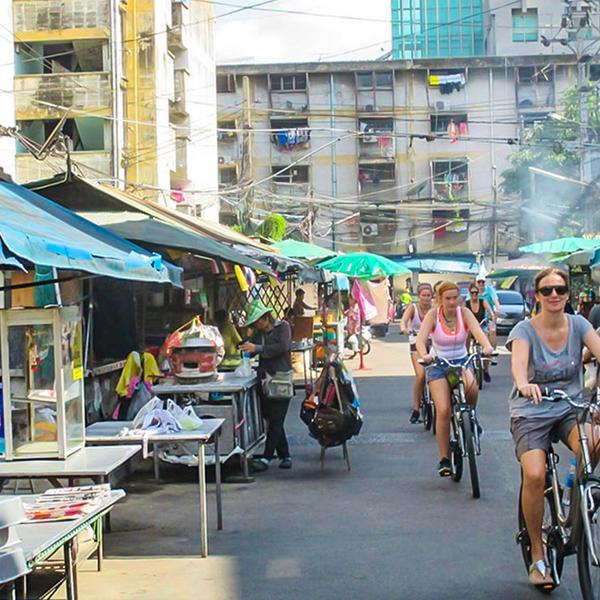 Explore the Bustling City & Backstreets on an Afternoon Biking Tour with Snacks & Drinks 3