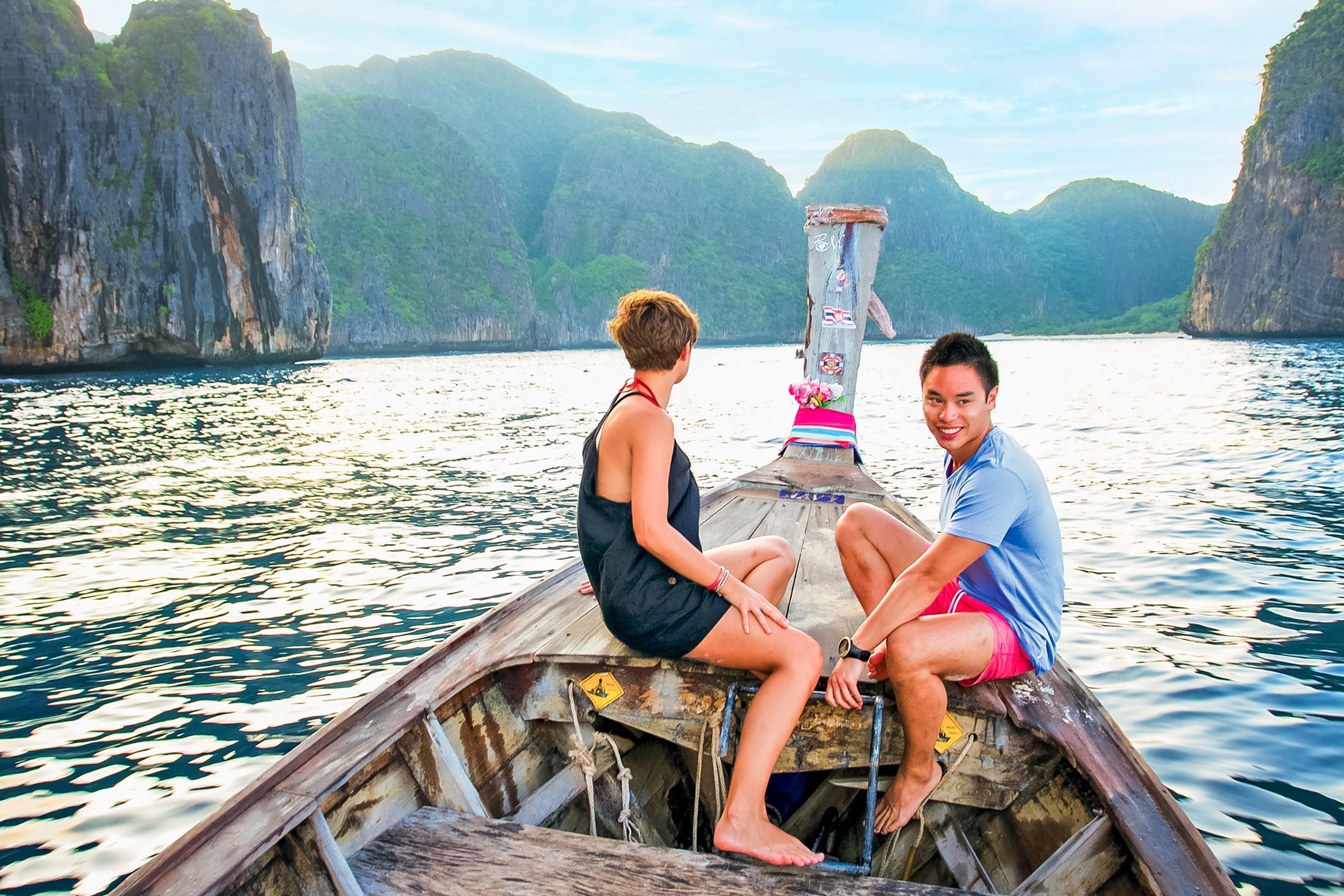 Travellers enjoying a boat trip in Thailand